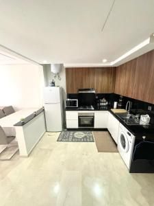 Kuchyň nebo kuchyňský kout v ubytování Mama cosy - Clim, Wifi, Piscine en centre ville