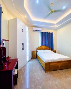 En eller flere senge i et værelse på 3 Bedroom Apartment North Legon