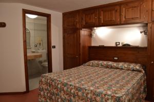 Postel nebo postele na pokoji v ubytování Hotel Petit Giles