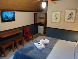 Cama ou camas em um quarto em Pousada dos Anjos