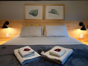 Cama ou camas em um quarto em Pousada dos Anjos