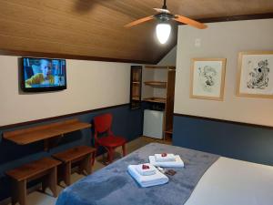 Cama ou camas em um quarto em Pousada dos Anjos