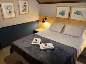 Cama ou camas em um quarto em Pousada dos Anjos