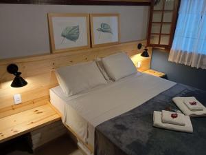 Cama ou camas em um quarto em Pousada dos Anjos