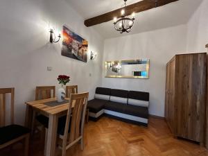 a living room with a couch and a table at Old Cracow Apartment I in Krakow