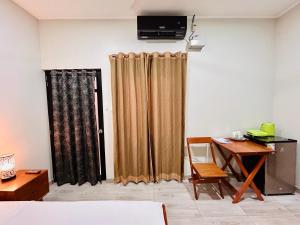 TV a/nebo společenská místnost v ubytování Habitación Céntrica en Iquitos - Casa Alemi 10