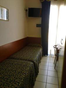 Posteľ alebo postele v izbe v ubytovaní Hotel Lido