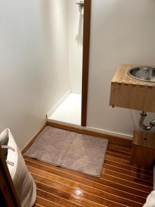 a small bathroom with a mirror and a sink at le sinagot in La Celle-sous-Gouzon