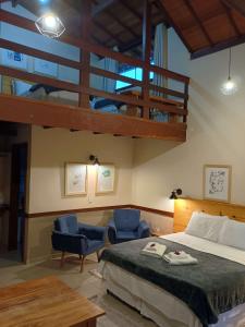 Cama ou camas em um quarto em Pousada dos Anjos