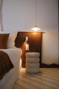 Letto o letti in una camera di Boutique Hôtel Responsable et Restaurant Basgi Basgi
