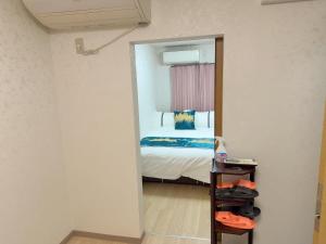 a bedroom with a bed and a mirror at 瀬戸内瓦町201 in Takamatsu +14 photos