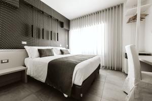 Letto o letti in una camera di B&B LUMAS