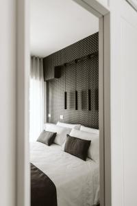 Letto o letti in una camera di B&B LUMAS