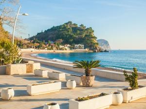 a view of a beach and the ocean at Apartments Adria in Petrovac na Moru