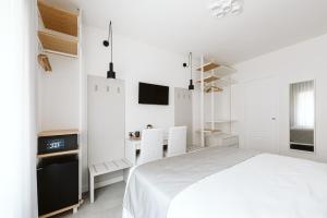 Letto o letti in una camera di B&B LUMAS