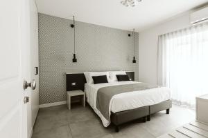 Letto o letti in una camera di B&B LUMAS
