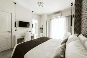 Letto o letti in una camera di B&B LUMAS