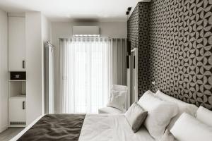 Letto o letti in una camera di B&B LUMAS