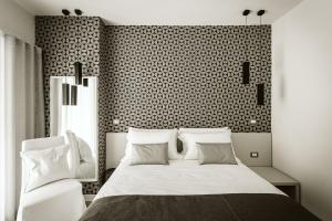 Letto o letti in una camera di B&B LUMAS