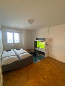 Ένα ή περισσότερα κρεβάτια σε δωμάτιο στο 3-rooms Arena apartment