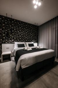 Letto o letti in una camera di B&B LUMAS
