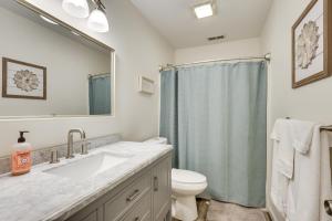 a bathroom with a sink and a toilet and a mirror at Family Getaway Less Than 2 Mi to Massanutten Ski Lodge! in McGaheysville +35 photos