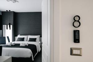 Letto o letti in una camera di B&B LUMAS