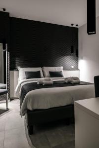 Letto o letti in una camera di B&B LUMAS
