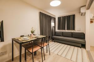 a living room with a table and a couch at Apb 两国 in Tokyo