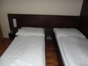 Postel nebo postele na pokoji v ubytování Hotel Arli
