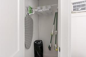 a closet with a bunch of umbrellas in it at Leech Lake Views Quaint Stay Near Town & Hiking in Walker