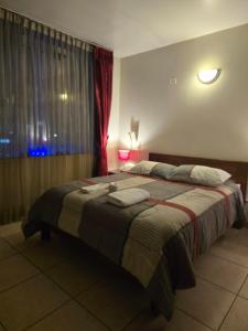 Postel nebo postele na pokoji v ubytování Amaru Peru Hotel