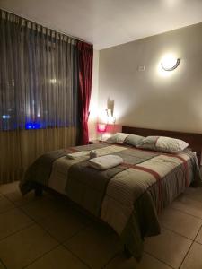 Postel nebo postele na pokoji v ubytování Amaru Peru Hotel