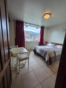 Postel nebo postele na pokoji v ubytování Amaru Peru Hotel