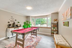 a room with a ping pong table in it at Foosball Games and Al Fresco Dining Pensacola Home! in Pensacola