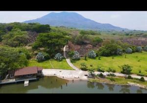 a house in the middle of a body of water at La Isla Ipala in San Isidro