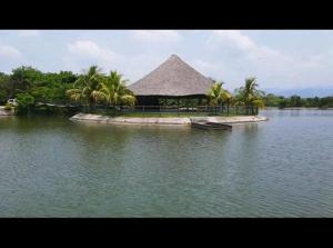 a large building in the middle of a body of water at La Isla Ipala in San Isidro