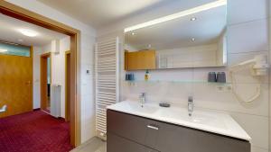 Koupelna v ubytování Bräuhaus Appartements + 25 fotografií