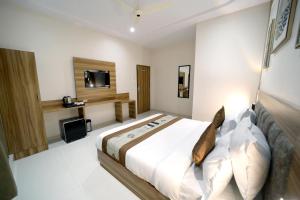 Postel nebo postele na pokoji v ubytování HOTEL ALFA EXECUTIVE