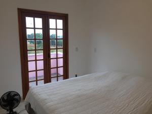 Ένα ή περισσότερα κρεβάτια σε δωμάτιο στο Casa rosa