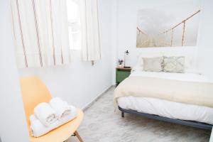 A bed or beds in a room at C57 - Spacious and Bright Apartment