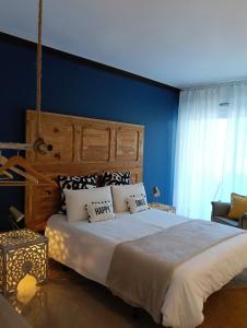 Ένα ή περισσότερα κρεβάτια σε δωμάτιο στο São João da Caparica Beach Apartment