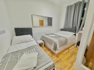 Postel nebo postele na pokoji v ubytování Venice Hotel
