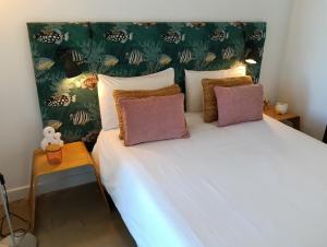 Ένα ή περισσότερα κρεβάτια σε δωμάτιο στο São João da Caparica Beach Apartment