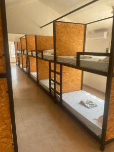 a group of bunk beds in a room at Hotel/Hostal Casa Blanca in Aquismón