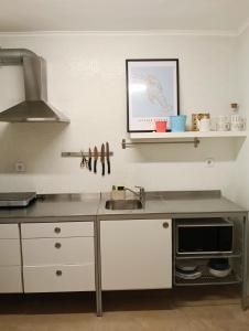 Η κουζίνα ή μικρή κουζίνα στο São João da Caparica Beach Apartment