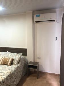 a living room with a couch and a table at Peppy Tower 1190 in Posadas