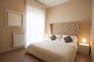 Кровать или кровати в номере Residence Sole Mare Alaxi Hotels