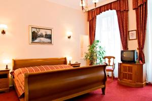 TV a/nebo společenská místnost v ubytování Hotel Wollner