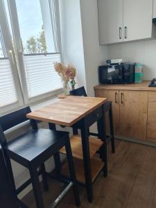 Kuchyň nebo kuchyňský kout v ubytování Apartament z Napoleonem w tle